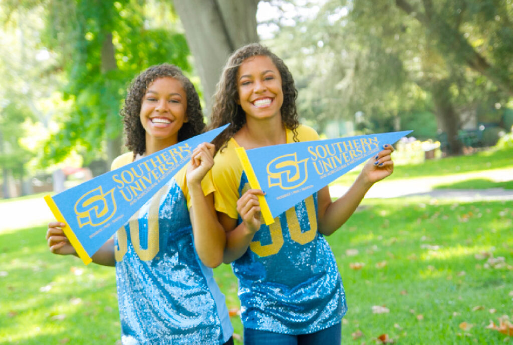 Million Dollar March - Two female Southern University students are holding Southern University banners.